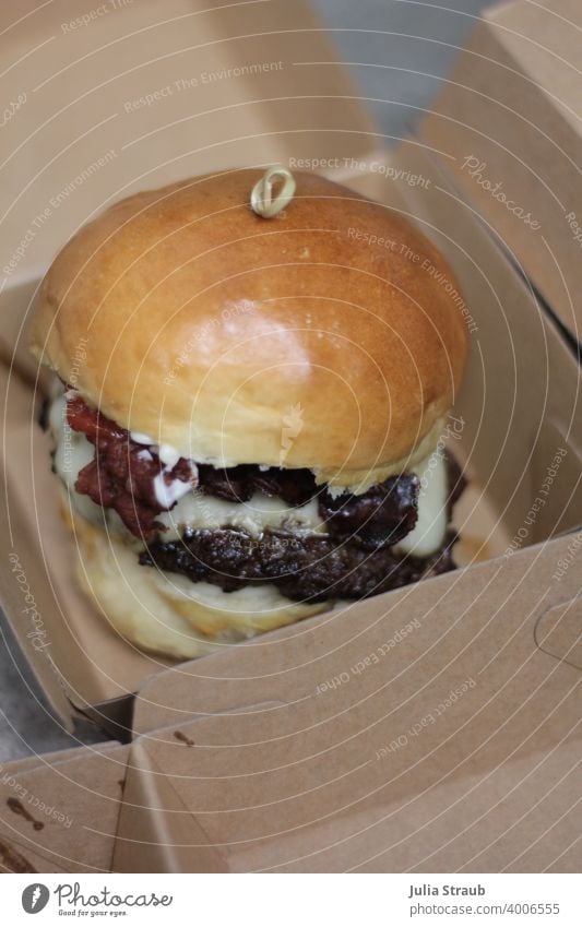 homemade cheeseburger in kraft paper packaging box burger buns Burgerlove Cheeseburger Patty Meat minced beef Glittering Bacon Delicious Fluffy Fast food