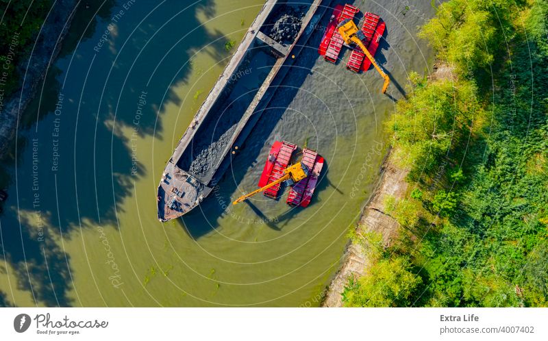 Aerial view of river, canal is being dredged by excavators Above Activity Backhoe Barge Boat Bucket Charge Civil Engineering Clean Dig Digger Dredge Dredger