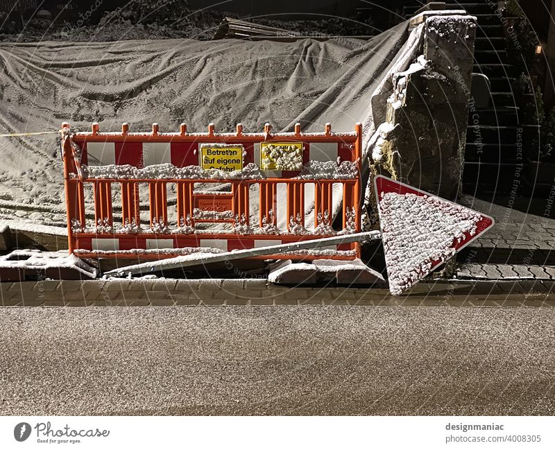 Snowed-in construction site. That way! Construction site construction site sign site fence No trespassing enter at your own risk yellow sign Signs and labeling