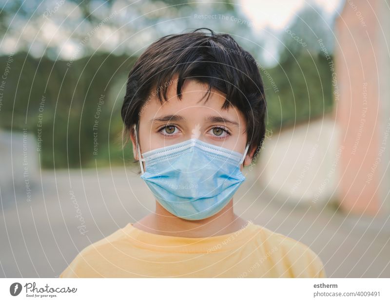 Close-up of kid wearing protective surgical mask coronavirus medical mask covid epidemic pandemic quarantine child covid-19 2019-ncov covid 19 symptom medicine