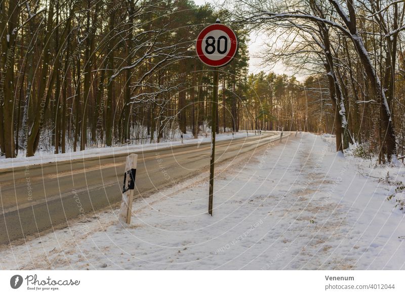 Germany , Land Brandenburg , February 10, 2021 , Gottower Chaussee K7222 between the town of Luckenwalde and the village of Gottow,Country road in winter with snow in the late afternoon