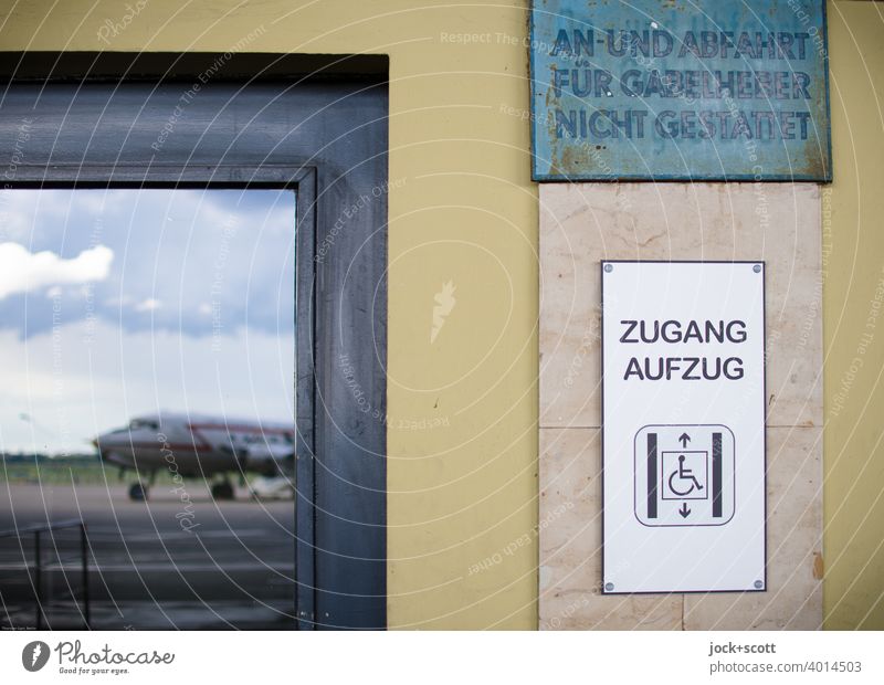 Elevator access from the tarmac Detail Reflection Airplane Vacation & Travel Sky Clouds Access Key Pictogram Wheelchair Tempelhof Airport Berlin Airfield