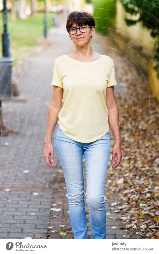 Foto de Beautiful mature woman on a walking. A nice middle aged