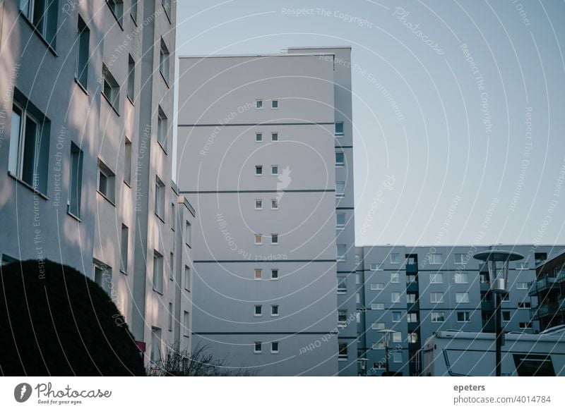 Grey blue house wall of a prefabricated building in Hamburg Steilshoop Prefab construction Panel construction Blue Gray ultimate grey Shadow Window