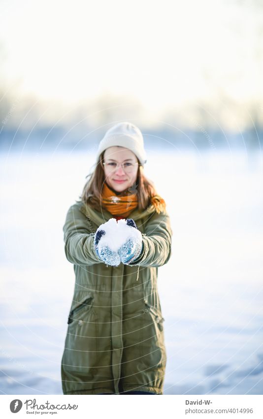 Woman holding snow in her hands and happy about winter Snow Joy stop Euphoria Winter Winter's day onset of winter Winter mood