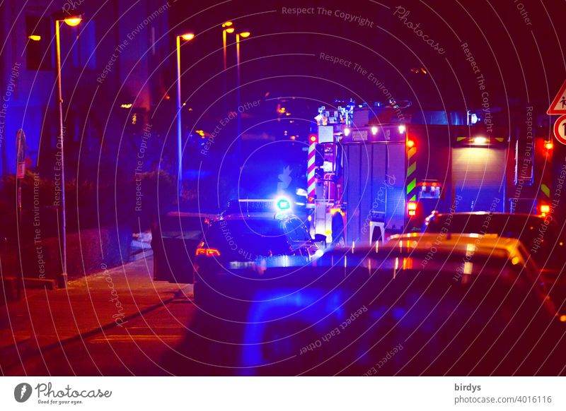 Nocturnal operation of the fire brigade Fire department Fire department deployment blue light Alarm Fire engine Night Residential area clearer