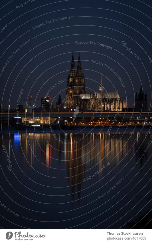 Cologne Cathedral by night, iluminated, reflection in the Rhine river architectural architecture attraction baroque blue building cathedral catholic catholicism