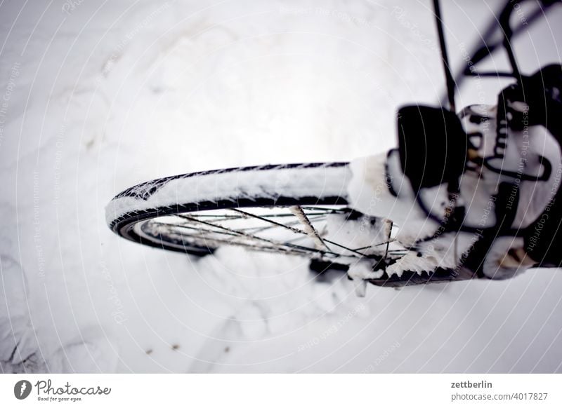 Front wheel in snow Snow Virgin snow Snowfall Winter winter holidays Wheel Bicycle Spokes Wheel rim winter tyres handicap smooth peril Dangerous