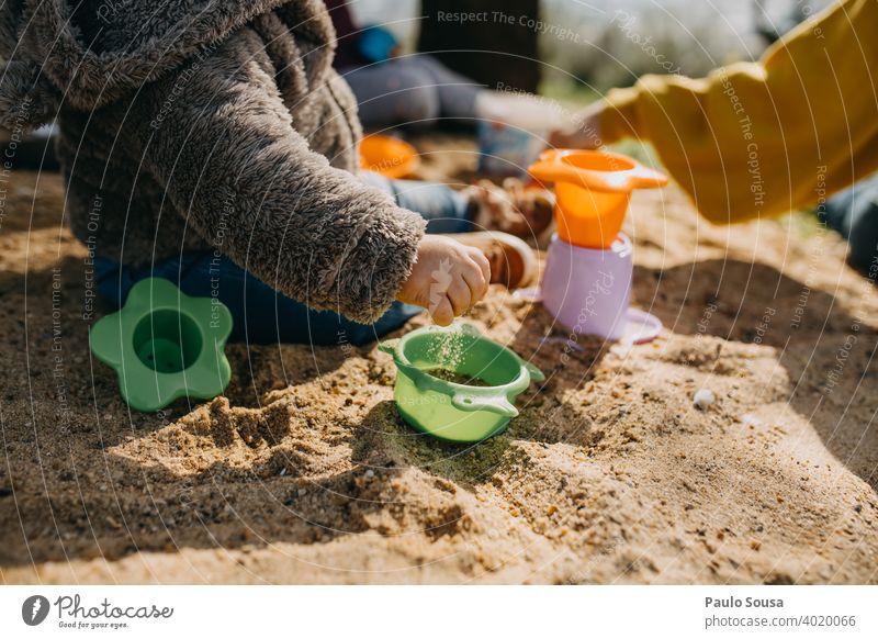 Child playing outdoors with sand childhood Playing Sand Toys Childhood memory Infancy Sandpit Kindergarten Joy Toddler Colour photo Children's game
