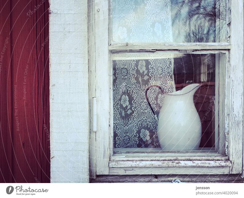 Milk can behind a transom window Scandinavian Swede Swedish Window Wood Curtain White Red Old Weathered weathered wood Glass Wooden house Wooden window Detail
