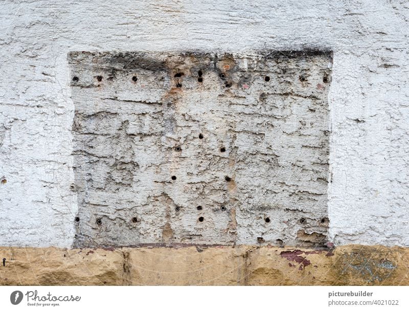 House wall with drill holes and outline of a chewing gum machine Wall (building) Wall (barrier) house wall Drilling wall paint Colour White Pedestal
