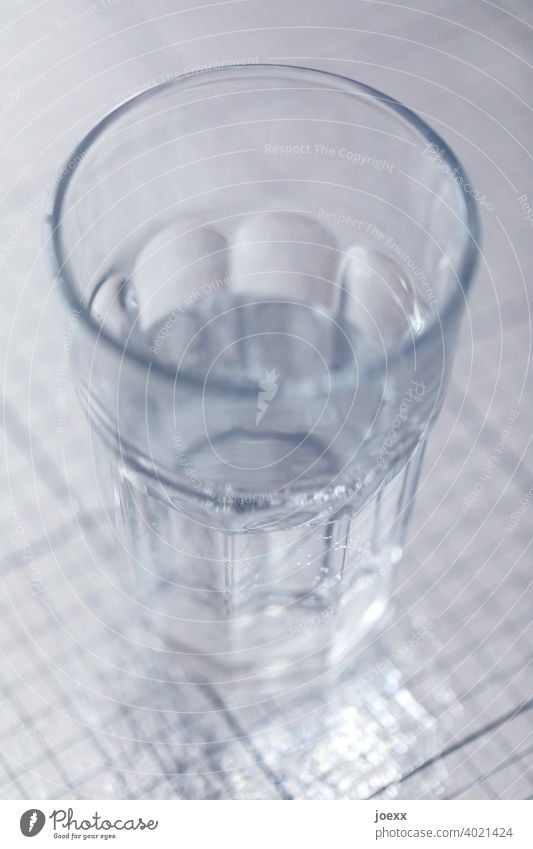 Glass of water, half full, on shiny surface Water Drinking Thirst Tumbler drinking glass receptacle Fluid Healthy Nutrition Moderate Fresh Colour photo