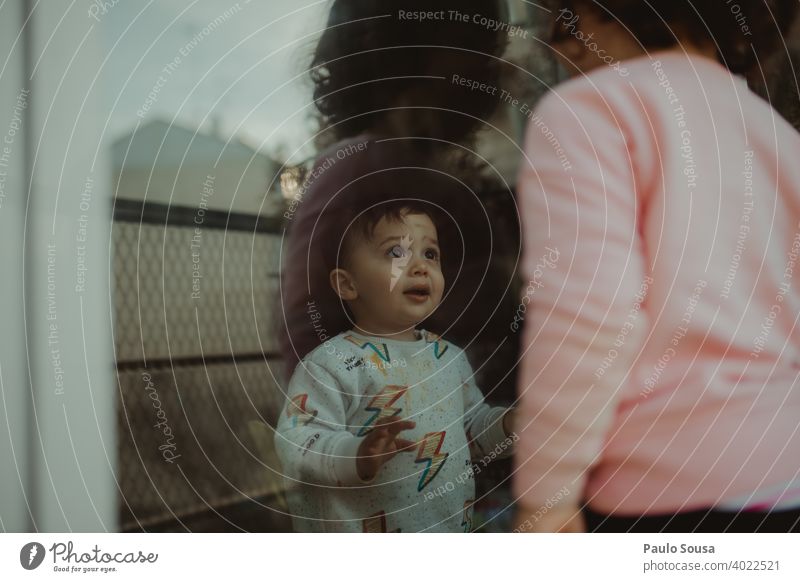 Toddler looking at sister through the window Brothers and sisters Family & Relations family Together togetherness Joy Love Boy (child) Friendship 2 Colour photo