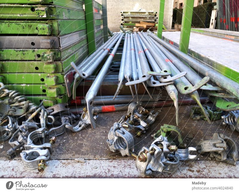 Iron rods and connecting parts of a scaffolding on the loading area of a truck at a construction site in Frankfurt am Main Bockenheim in Hesse, Germany Scaffold