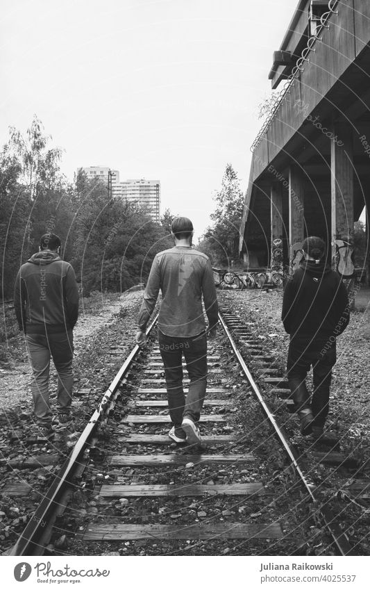 Three men on a ghost train station people Train station forsake sb./sth. Man masculine person young men Going three Joy Black & white photo Ghost Station Munich