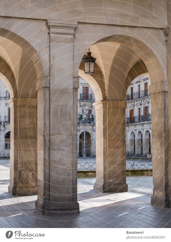 Light and shadow at the archway of the Plaza España in Vitoria, Basque Country, Spain Plaza Nueva Olaguibel Architecture columns Places downtown Exterior shot