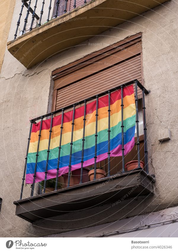 LGBT rainbow flag on a balcony on the front of a house somewhere in an old town in southern Europe Rainbow Rainbow flag gay lesbian Homosexual Love Freedom