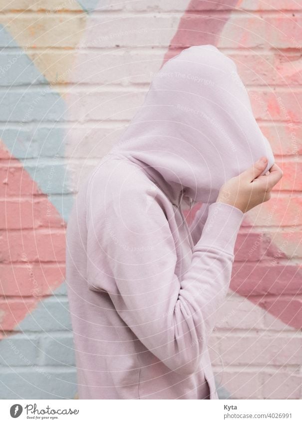 Introverted Teen Pulls their hoodie over their head introverted shy teen pastel Pastel tone pastel shades mental health mental illness depression