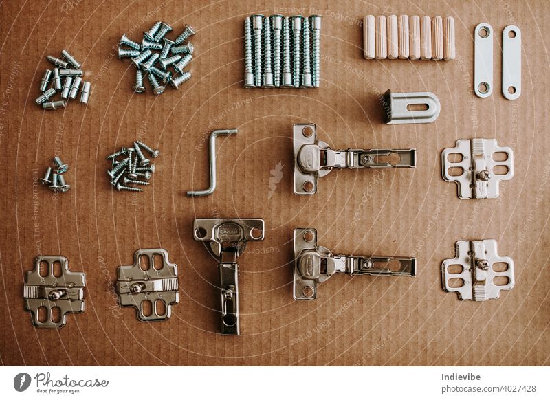 Top view arrangement group of parts for ready-to-assemble wooden furniture assembly on paper cardboard. Equipments for diy concept. screw set screws nail