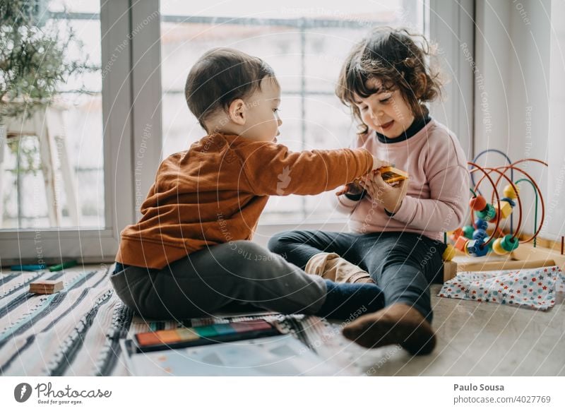 Brother and sister playing on the floor Brothers and sisters Family & Relations Child childhood Authentic Caucasian Emotions Toddler Playing Lifestyle Infancy