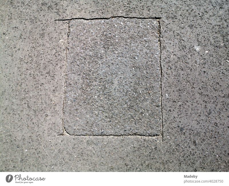 Marked rectangle in grey asphalt at the former Berlin Wall at Checkpoint Charlie in the capital Berlin, Germany Street Traffic lane Asphalt Woman road surface