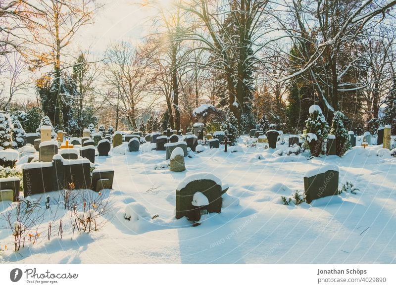 Grave in cemetery in winter with snow death and eternity Goodbye Funeral Coronatote Corona winter Eternity Cemetery Prayer commemoration Belief God God'sack