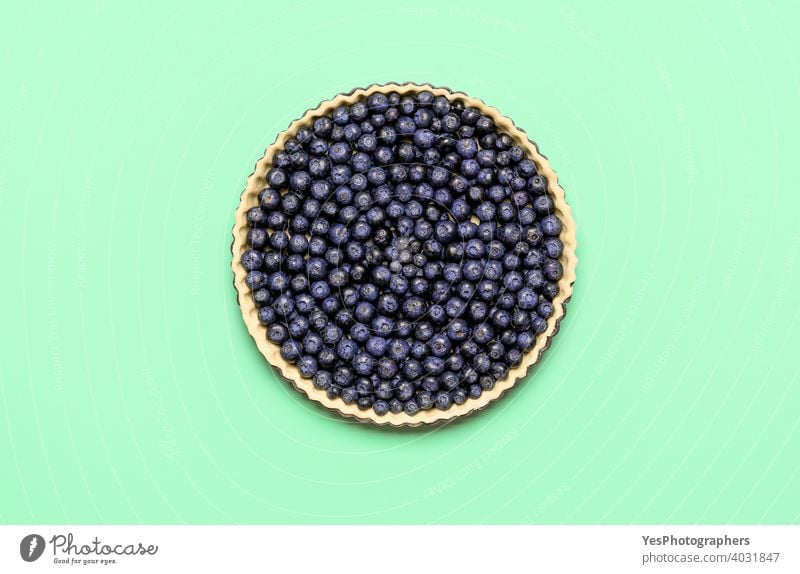 Blueberry pie, uncooked, isolated on colored background, top view. Baking pie at home 4th july above view american bake bakery baking bilberries
