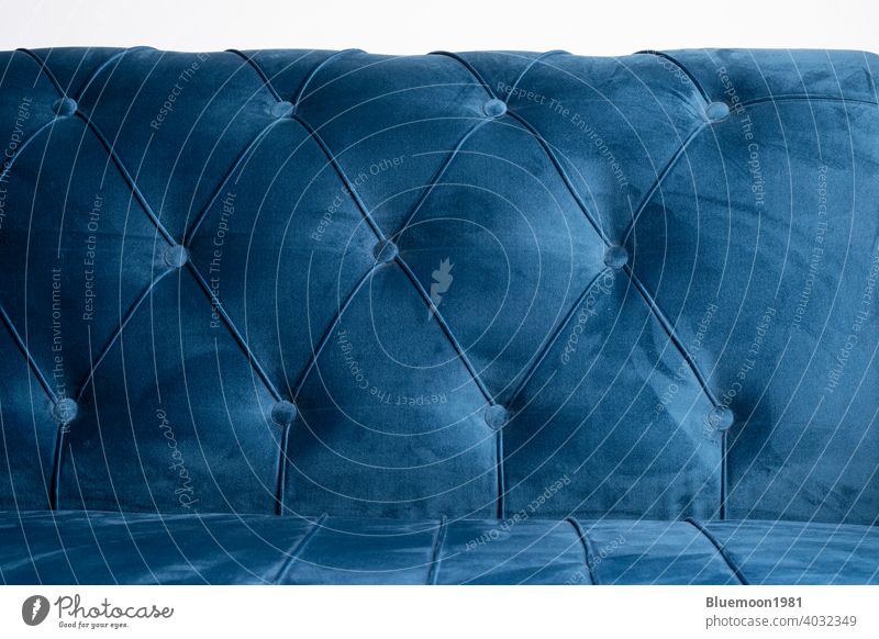 Blue velvet couch background texture with sunken buttons sofa soft color comfortable cozy cushion elegance fabric material object ornate pattern relax shape