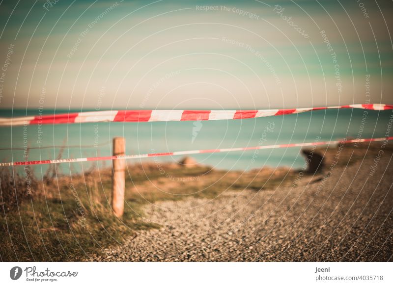 Caution Danger of falling! So beautiful and yet so dangerous | Break-off edge on the steep coast | Protection with a red and white barrier tape Warn cordon Red