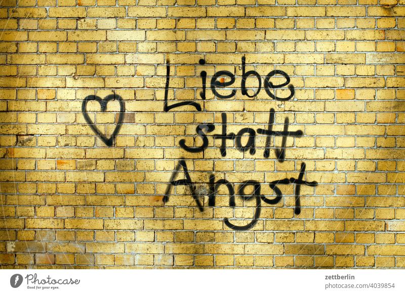 Love instead of fear Fear Message embassy slogan policy Wall (barrier) Wall (building) clinker Heart Affection Romance tagg sprayer sprayed alternative