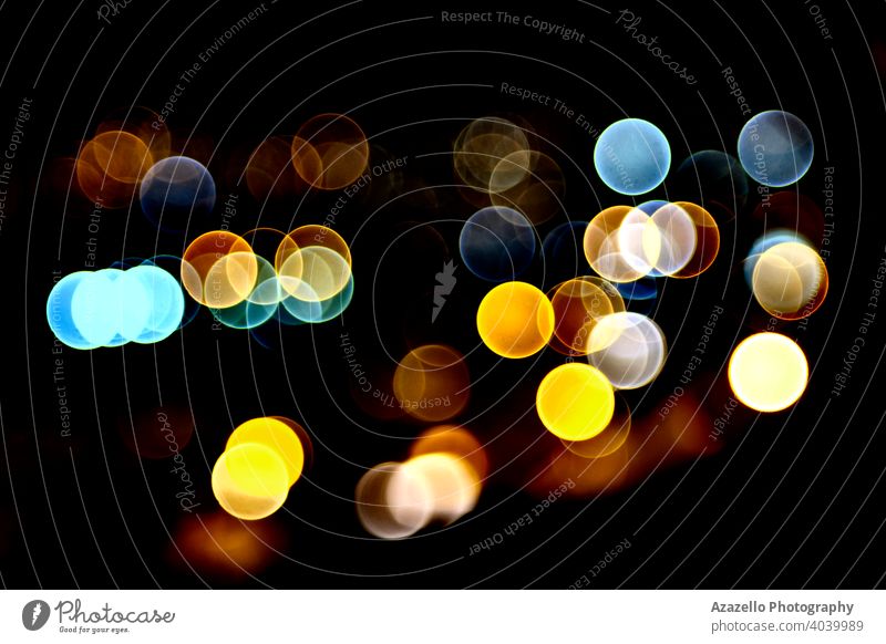 Black background with vivid colorful bokeh circles abstract blur blurred blurry bright celebration christmas colour dark decoration defocused design dot effect