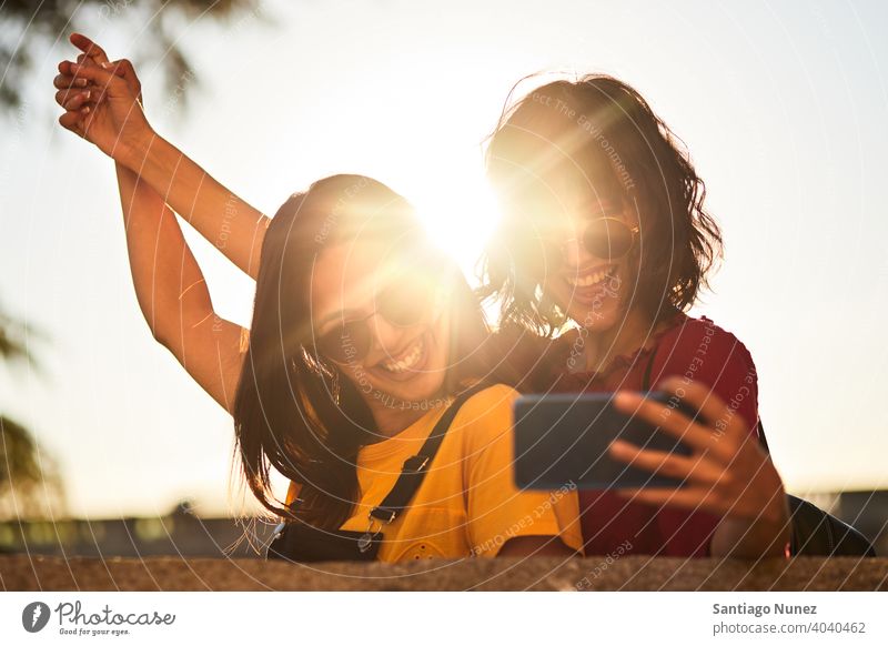 Two teenager girls taking a selfie. - a Royalty Free Stock Photo