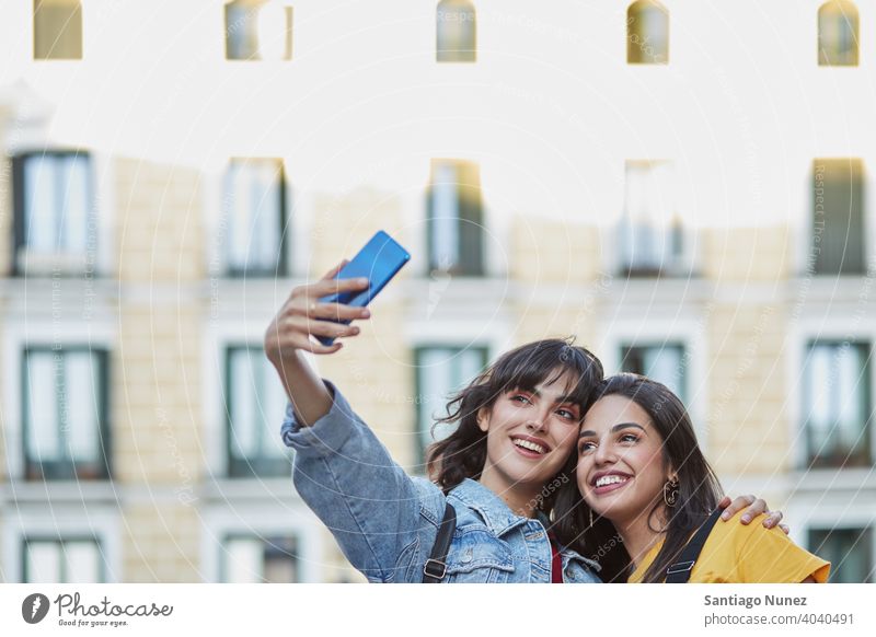 Two teenager girls taking a selfie. madrid young people friendship lifestyle beautiful fun happy together leisure woman smiling teens cheerful female youth