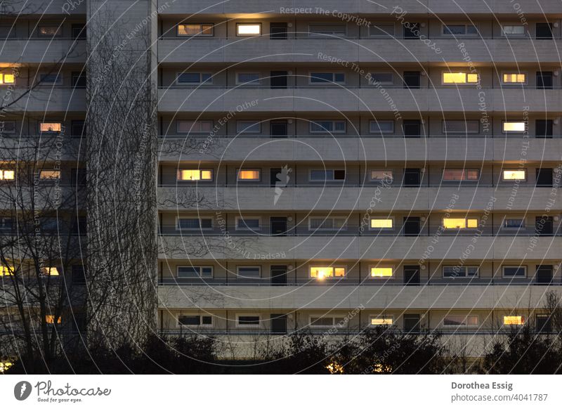 Apartment block with illuminated windows dwell block of flats stay at home Evening Light seclusion Window Facade Town Architecture Balconies Exterior shot