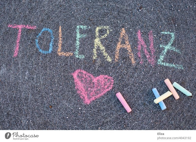 The word tolerance written with colorful sidewalk chalk Tolerant Word authored variegated street-painting chalk Chalk Text Heart LGBTQ at the same time