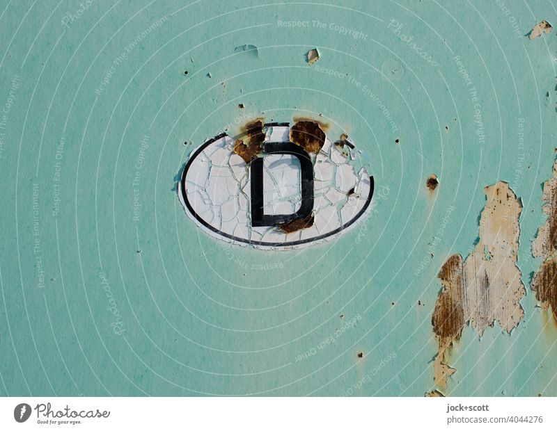 Country code D Germany Rust Oval Crack & Rip & Tear Retro Green Transience Change Made in Germany Detail Neutral Background Ravages of time Weathered Design