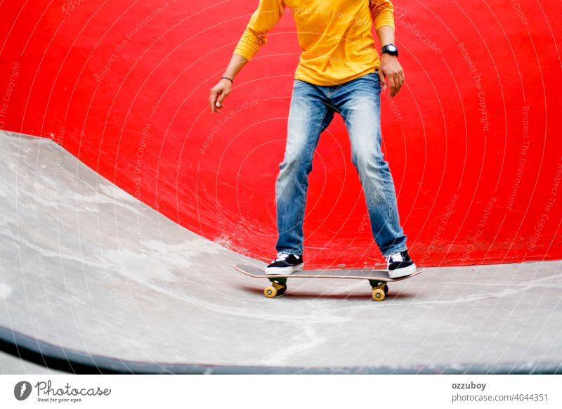 Skateboard Playing Standing Lifestyle Relaxing Concept red yellow sport skateboard playing fun lifestyle balance joy exercise extreme shoe fashion concrete