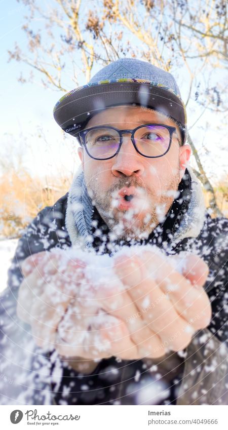 blow the snow blowing Winter Winter mood Cold Weather Freeze Portrait photograph portrait Situation blurriness in the foreground Cap