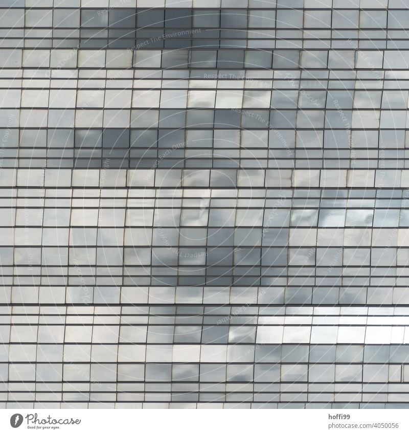 abstract glass facade in which clouds and light are reflected Building architectural photography Urbanization Architecture Glas facade Glass Window Facade