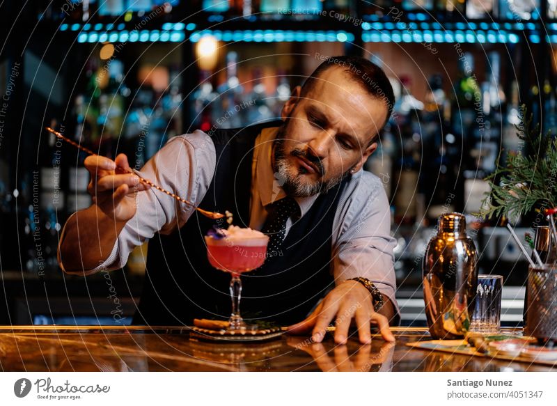 Barman is making cocktail at night club. bartender nightclub pub beverage liquor barman alcohol drink party restaurant professional nightlife preparation shaker