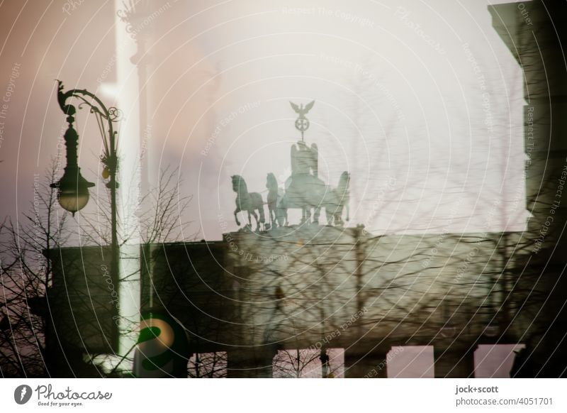 Brandenburg Gate through reflection Sightseeing Historic Tourist Attraction Landmark Capital city Quadriga Pariser Platz Berlin Sky Back-light Silhouette