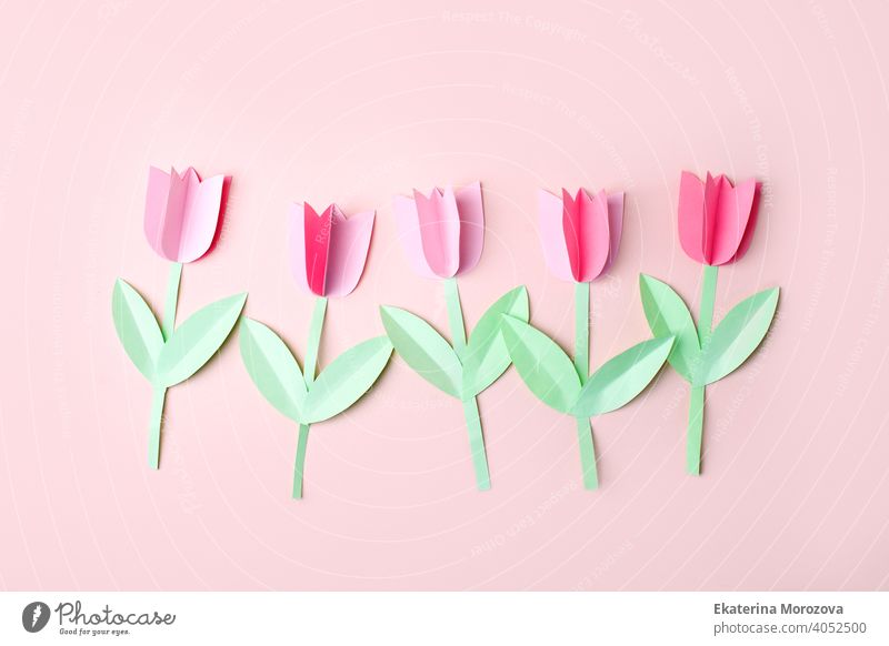 Happy easter spring concet - papercraft seasonal flowers on pink background for kids holiday party concept background. Handicrafts, DIY. creative idea from paper, copy space, banner, flyer