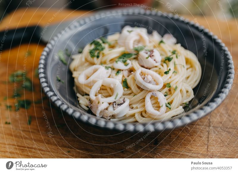 Spahetti with squid Spaghetti Squid Spaghetti straps Pasta Italian Italian Food Garlic Parsley healthy dry Close-up Ingredients Cooking ready to eat Plate Dish