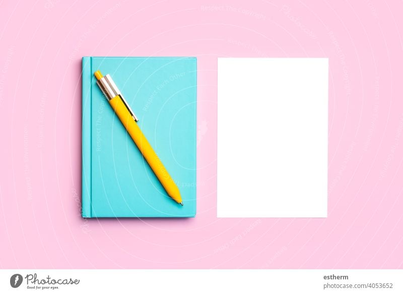 workspace desk with blue notepad,yellow pen and white paper with copy space background notepaper pencil mock frame memory desktop mockup idea color project