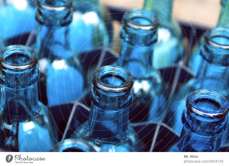blue glass bottles Glassbottle Mineral water empty water tank Thirst Containers and vessels Blue tone Bottle Transparent Neck of a bottle Beverage Drinking