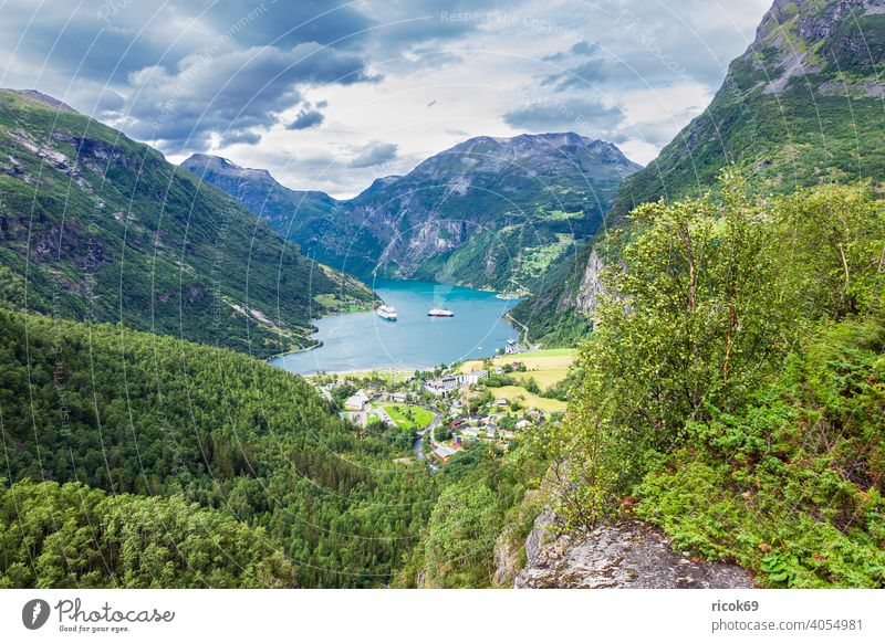 View of Geiranger and the Geirangerfjord in Norway. Fjord location Harbour boat ship Building Architecture Cruise liner mountain Rock Tree Møre og Romsdal
