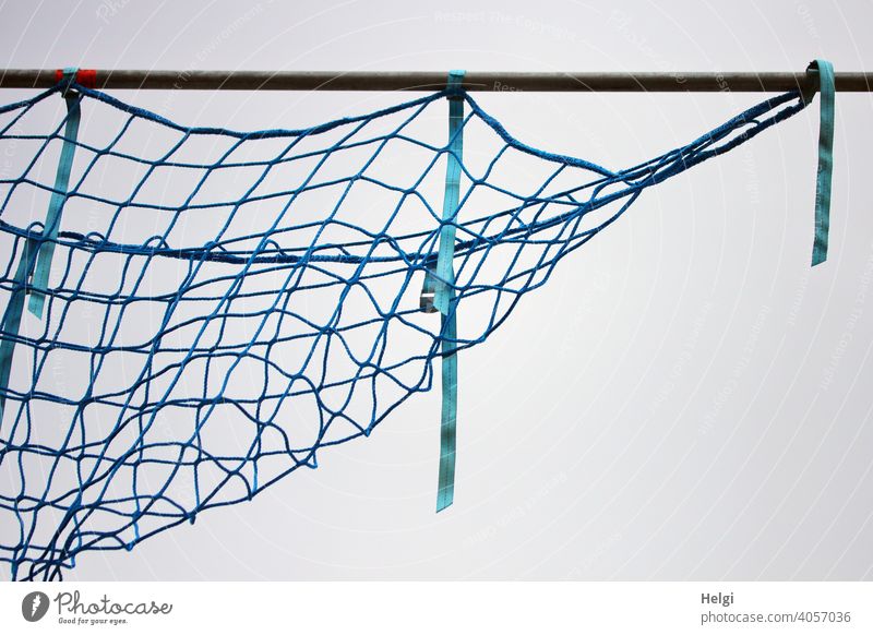blue net on a pole for safety and protection on a construction site Net Construction site Backup Metal Plastic Protection Inappropriate Blue Gray Colour photo