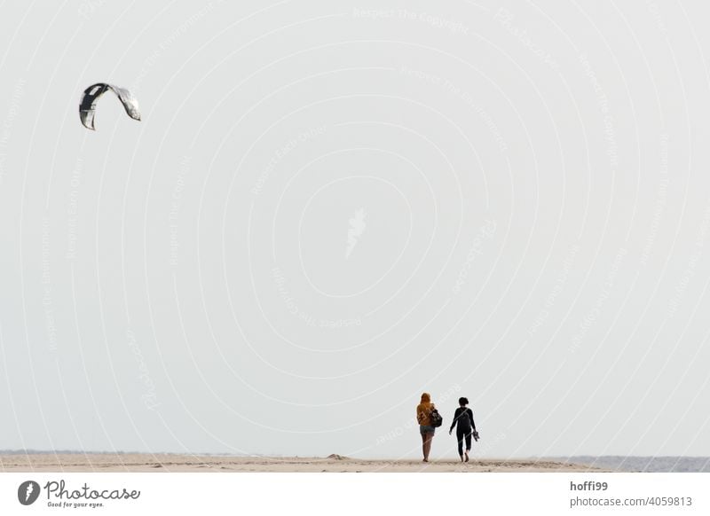 A kite sail and two people on the beach kitesurfer Partner Relaxation Together Beach Nature coast Water Ocean Atlantic Ocean atlantic ocean Desert stage