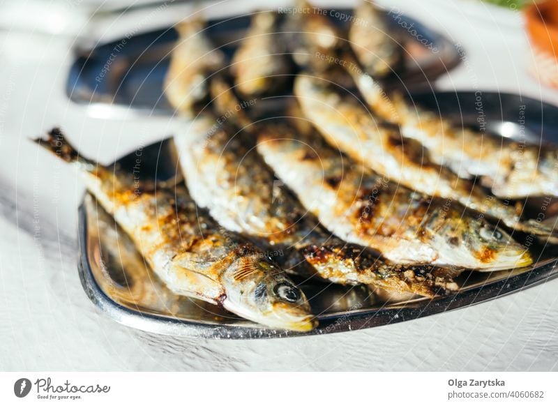 Fried sardines on the plate. fried portuguese food traditional cooked delicious fish meal portugal fresh healthy mediterranean prepared typical eating omega