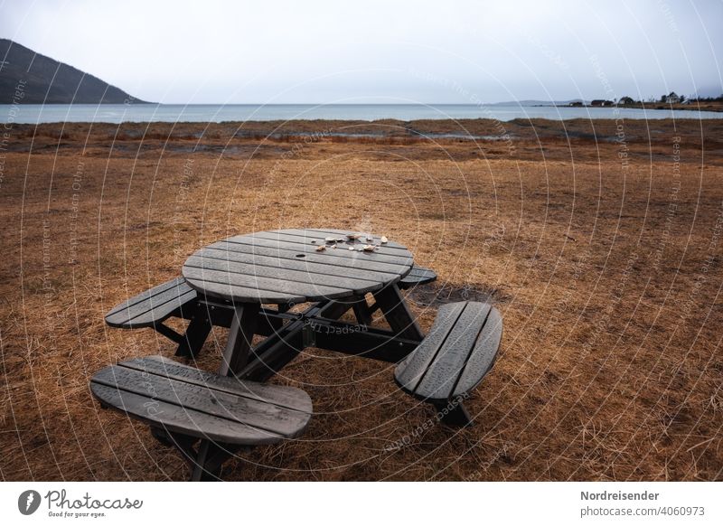 Resting place by the sea in the rain Beach Rain Ocean Camping site bench coast Atlantic Ocean North Atlantic Water Meadow Grass Fjord Senja Island Norway